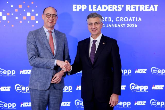 Croatian Prime Minister Andrej Plenkovic (R) shakes hands withLuxembourg Prime Minister Luc Frieden (L) at the start of a two-day informal meeting of leaders of the European People’s Party (EPP), Europe’s largest political group, in Zagreb, on January 30, 2026. (Photo by MARKO PERKOV / AFP)