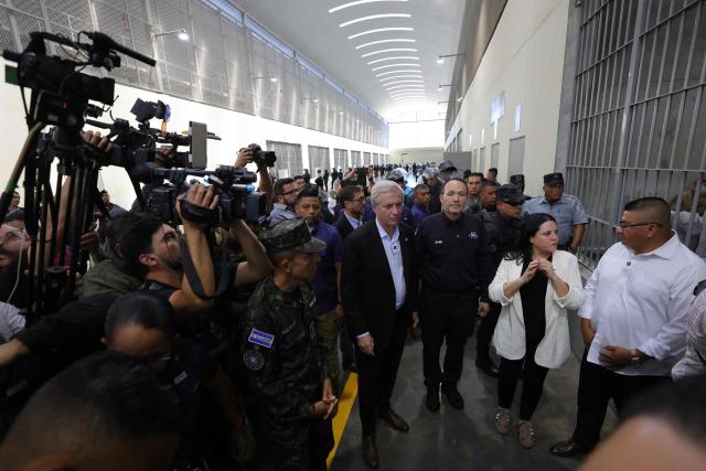 Chile’s president-elect Jose Antonio Kast (C) visits the Counter-Terrorism Confinement Centre (CECOT) mega-prison, where hundreds of MS-13 and 18th Street gang members are being held, accompanied by El Salvador’s Minister of Justice and Public Security Gustavo Villatoro (3rd R), in Tecoluca, El Salvador, on January 29, 2026. The CECOT, the largest prison in Latin America and emblem of the war against gangs of the government of President Nayib Bukele, celebrates two years since it was inaugurated on February 1. (Photo by Oscar Rivera / AFP)