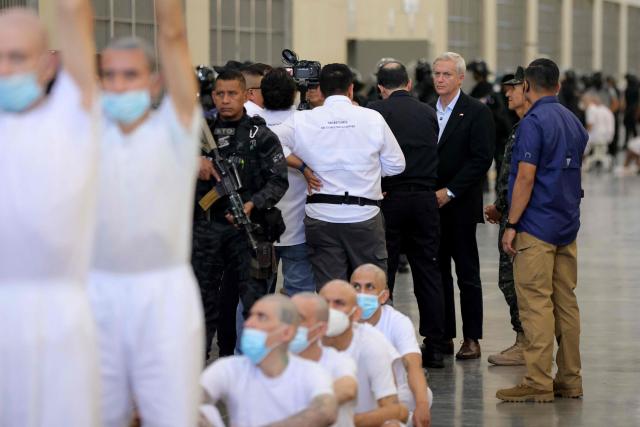 Chile's president-elect Jose Antonio Kast (3-R) looks at inmates during a visit to the Counter-Terrorism Confinement Centre (CECOT) mega-prison, where hundreds of MS-13 and 18th Street gang members are being held, in Tecoluca, El Salvador, on January 29, 2026. The CECOT, the largest prison in Latin America and emblem of the war against gangs of the government of President Nayib Bukele, celebrates two years since it was inaugurated on February 1. (Photo by Oscar RIVERA / AFP)