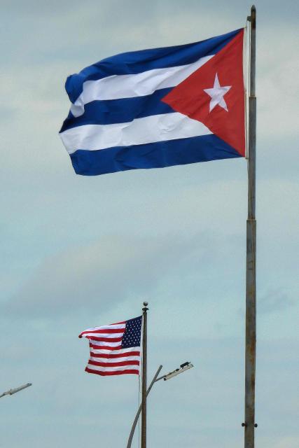 This view shows a US flag at the embassy and a Cuban flag in Havana on January 30, 2026. Cuban President Miguel Diaz-Canel on January 30, 2026, denounced US President Donald Trump’s attempt to “asphyxiate” the communist island’s economy under a “false pretext.” (Photo by ADALBERTO ROQUE / AFP)
