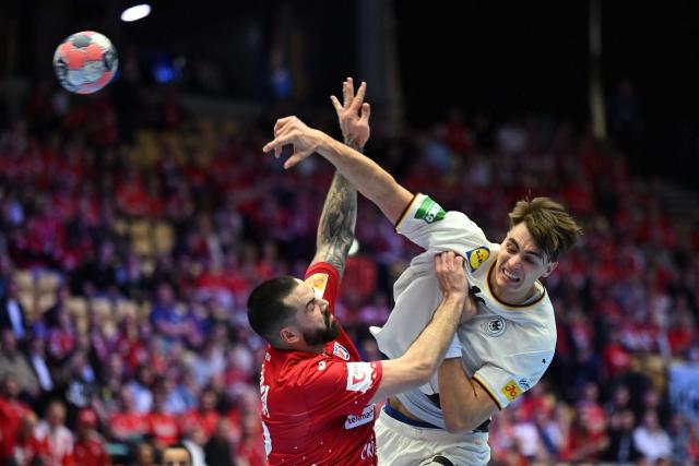 Croatia's pivot #52 Leon Susnja and Germany's left back #18 Julian Koster vie for the ball during the men's EHF Euro 2026 semi-finals handball match Germany vs Croatia in Herning, Denmark, on January 30, 2026. (Photo by Jonathan Nackstrand / AFP)