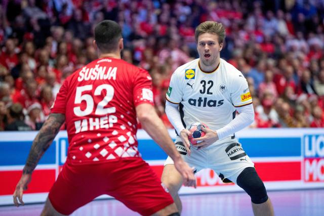 Croatia's pivot #52 Leon Susnja and Germany's right back #32 Franz Sempervie for the ball during the men's EHF Euro 2026 semi-finals handball match Germany vs Croatia in Herning, Denmark, on January 30, 2026. (Photo by Bo Amstrup / Ritzau Scanpix / AFP) / Denmark OUT