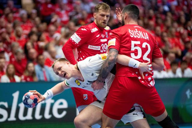 Germany's pivot #54 Justus Fischer and Croatia's left back #38 Ante Ivankovic  and Croatia's pivot #52 Leon Susnja vie for the ball during the men's EHF Euro 2026 semi-finals handball match Germany vs Croatia in Herning, Denmark, on January 30, 2026. (Photo by Bo Amstrup / Ritzau Scanpix / AFP) / Denmark OUT