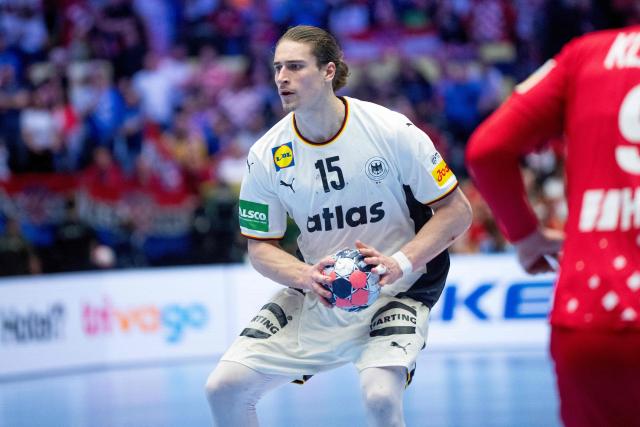 Germany's centre back #15 Juri Knorr holds the ball during the men's EHF Euro 2026 semi-finals handball match Germany vs Croatia in Herning, Denmark, on January 30, 2026. (Photo by Bo Amstrup / Ritzau Scanpix / AFP) / Denmark OUT