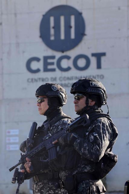 National Civil Police (PNC) officers stand guard before the arrival of Chile's president-elect Jose Antonio Kast at the Counter-Terrorism Confinement Center (CECOT) mega-prison, where hundreds of MS-13 and 18th Street gang members are being held, in Tecoluca, El Salvador, on January 29, 2026. The CECOT, the largest prison in Latin America and emblem of the war against gangs of the government of President Nayib Bukele, celebrates two years since it was inaugurated on February 1. (Photo by Oscar Rivera / AFP)
