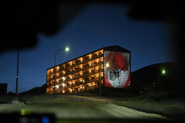 A residential building is seen through the window of a taxi at the city of Sisimiut, Greenland on January 30, 2026. (Photo by Ina FASSBENDER / AFP)