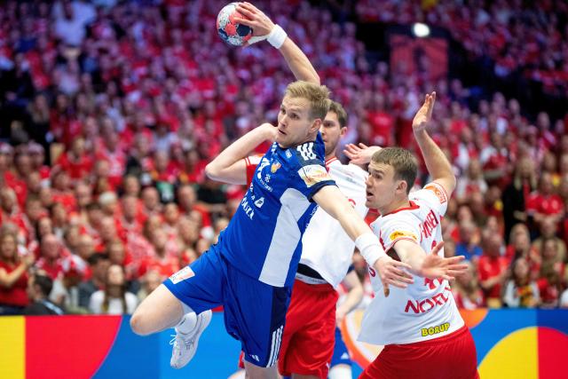 Iceland's Ellidi Snaer Vidarsson (C) shoots against Denmark's Thomas Arnoldsen and Magnus Landin during the men's EHF Euro 2026 semi-finals handball match Denmark vs Iceland in Herning, Denmark, on January 30, 2026. (Photo by Bo Amstrup / Ritzau Scanpix / AFP) / Denmark OUT