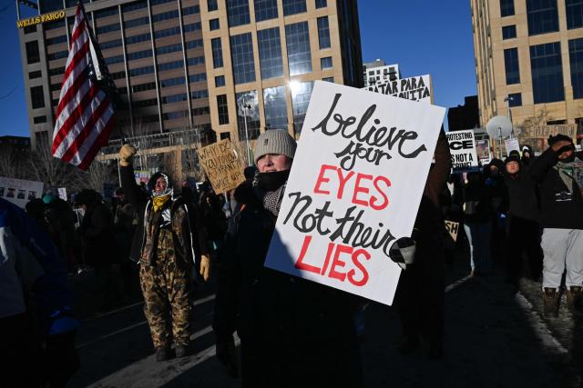 People protest during a march against US Immigration and Customs Enforcement (ICE) in Minneapolis, Minnesota, on January 30, 2026. Donald Trump's border chief said January 29, 2026 that some federal agents could be withdrawn from Minneapolis, the northern US city that has become the flashpoint for the president's immigration crackdown. The Trump administration, facing a public backlash over the shooting deaths of two Americans by federal agents in Minneapolis, also eased immigration operations in the northeastern state of Maine. (Photo by ROBERTO SCHMIDT / AFP)