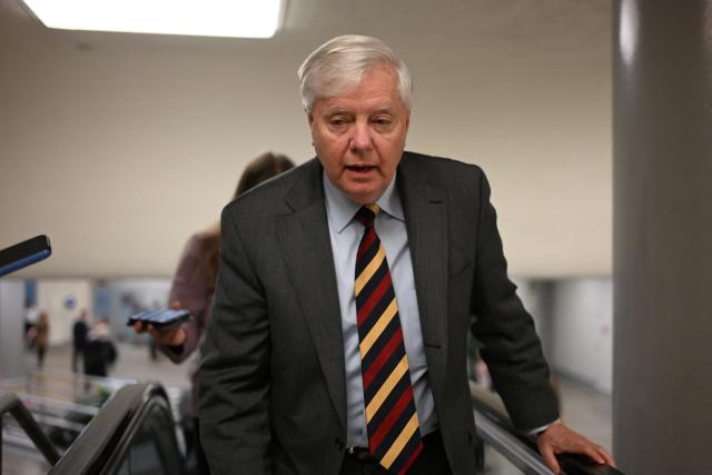 US Senator Lindsey Graham, Republican of South Carolina, walks in the halls of the US Capitol in Washington, DC, on January 30, 2026. US senators began voting on a deal backed by President Donald Trump to avert the worst impact of an imminent government shutdown, after a Republican holdout lifted his block following tense talks. Even if the Senate clears the package, a shutdown is still set to begin on Saturday because the House of Representatives is out of session until Monday, making a brief funding lapse unavoidable. (Photo by Alex WROBLEWSKI / AFP)