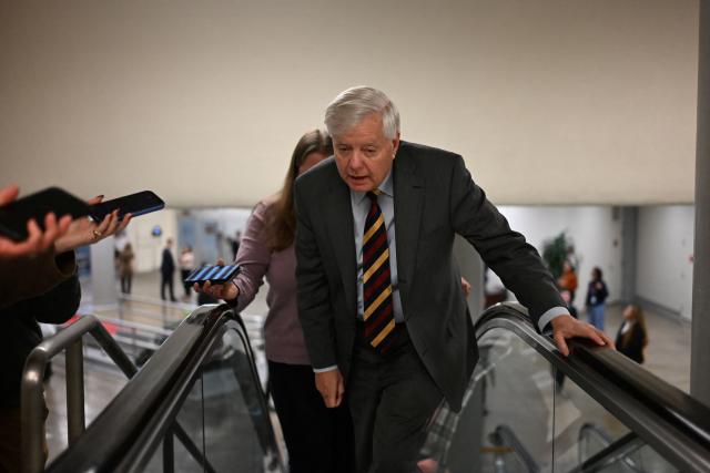 US Senator Lindsey Graham, Republican of South Carolina, walks in the halls of the US Capitol in Washington, DC, on January 30, 2026. US senators began voting on a deal backed by President Donald Trump to avert the worst impact of an imminent government shutdown, after a Republican holdout lifted his block following tense talks. Even if the Senate clears the package, a shutdown is still set to begin on Saturday because the House of Representatives is out of session until Monday, making a brief funding lapse unavoidable. (Photo by Alex WROBLEWSKI / AFP)
