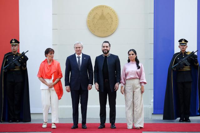 Chile's elected-president Jose Antonio Kast (2nd-L), his wife Maria Pia Adriasola (L), El Salvador's President Nayib Bukele (2nd-R), and his wife Gabriela Rodrigez (R) pose for a photo during a welcome ceremony at the Presidential House in San Salvador on January 30, 2026. (Photo by Oscar RIVERA / AFP)