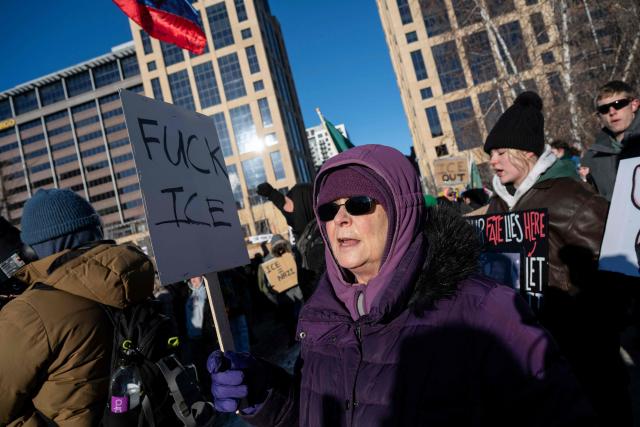A person holds an anti-ice sign during a "National Shutdown" protest against US Immigration and Customs Enforcement (ICE) in Minneapolis, Minnesota, on January 30, 2026. Donald Trump's border chief said January 29, 2026 that some federal agents could be withdrawn from Minneapolis, the northern US city that has become the flashpoint for the president's immigration crackdown. The Trump administration, facing a public backlash over the shooting deaths of two Americans by federal agents in Minneapolis, also eased immigration operations in the northeastern state of Maine. (Photo by ROBERTO SCHMIDT / AFP)