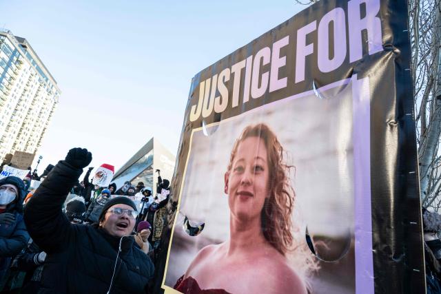 People hold a photo of Renee Good, who was shot dead by US Immigration and Customs Enforcement (ICE) agents, at the end of a "National Shutdown" protest in Minneapolis, Minnesota, on January 30, 2026. Donald Trump's border chief said January 29, 2026 that some federal agents could be withdrawn from Minneapolis, the northern US city that has become the flashpoint for the president's immigration crackdown. The Trump administration, facing a public backlash over the shooting deaths of two Americans by federal agents in Minneapolis, also eased immigration operations in the northeastern state of Maine. (Photo by ROBERTO SCHMIDT / AFP)