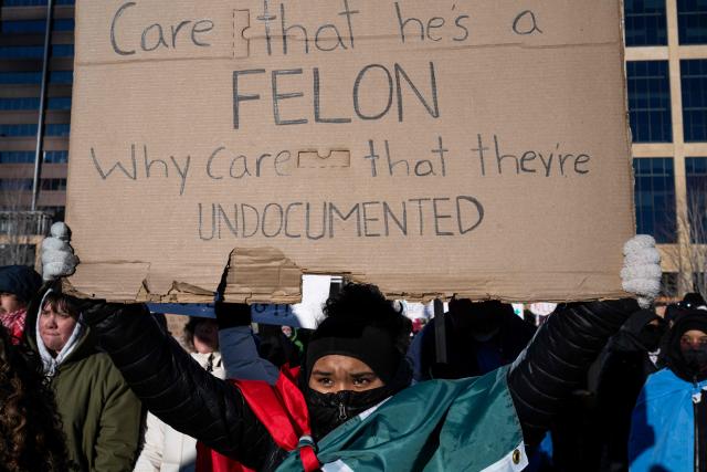 People hold signs during a "National Shutdown" protest against US Immigration and Customs Enforcement (ICE) in Minneapolis, Minnesota, on January 30, 2026. Donald Trump's border chief said January 29, 2026 that some federal agents could be withdrawn from Minneapolis, the northern US city that has become the flashpoint for the president's immigration crackdown. The Trump administration, facing a public backlash over the shooting deaths of two Americans by federal agents in Minneapolis, also eased immigration operations in the northeastern state of Maine. (Photo by ROBERTO SCHMIDT / AFP)