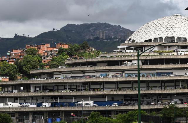 (FILES) A general view of the El Helicoide building, headquarters of the Bolivarian National Intelligence Service (SEBIN) in Caracas, taken on July 28, 2023. Venezuela's interim President Delcy Rodriguez announced on January 30, 2026, the closure of the notorious Helicoide prison in Caracas, which has been denounced as a torture centre by the opposition and human rights activists. (Photo by Yuri CORTEZ / AFP)