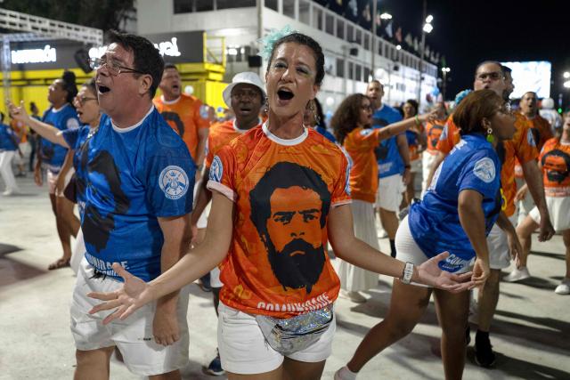 Revelers from the Academicos de Niteroi samba school parade during a technical rehearsal at the Sapucai sambadrome in Rio de Janeiro, Brazil on January 30, 2026. Academicos de Niteroi present an artistic proposal that pays tribute to Brazil's President Luiz Inacio Lula da Silva. (Photo by Pablo PORCIUNCULA / AFP)