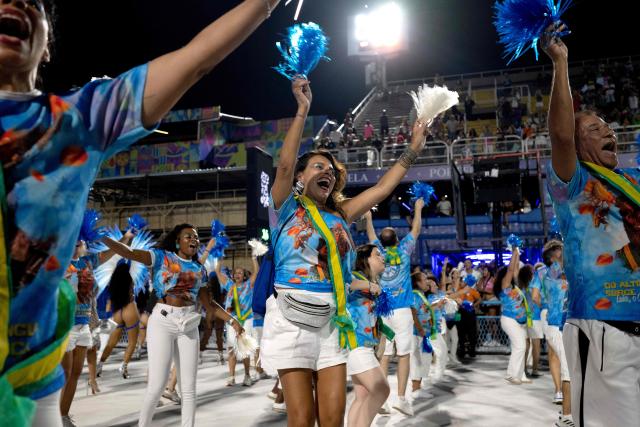 Revelers from the Academicos de Niteroi samba school parade during a technical rehearsal at the Sapucai sambadrome in Rio de Janeiro, Brazil on January 30, 2026. Academicos de Niteroi present an artistic proposal that pays tribute to Brazil's President Luiz Inacio Lula da Silva. (Photo by Pablo PORCIUNCULA / AFP)