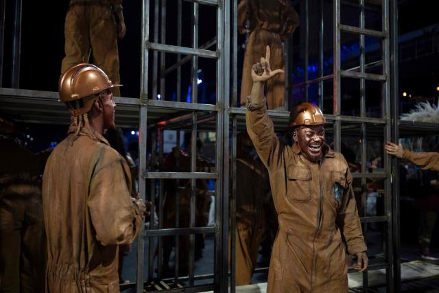 Revelers from the Academicos de Niteroi samba school, characterised as metalworkers, parade a technical rehearsal at the Sapucai sambadrome in Rio de Janeiro, Brazil on January 30, 2026. Academicos de Niteroi present an artistic proposal that pays tribute to Brazil's President Luiz Inacio Lula da Silva. (Photo by Pablo PORCIUNCULA / AFP)
