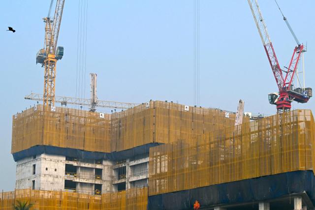 A general view shows the site of an under construction building in Mumbai on January 31, 2026. (Photo by Indranil Mukherjee / AFP)