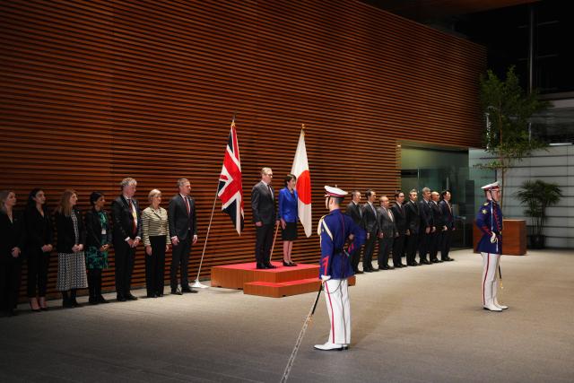 British Prime Minister Keir Starmer attends a ceremonial guard of honour with Japanese Prime Minister Sanae Takaichi at the Prime Minister's Office in Tokyo on January 31, 2026. (Photo by Carl Court / POOL / AFP)