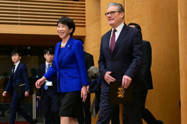 Japan's Prime Minister Sanae Takaichi (C) and Britain's Prime Minister Keir Starmer (R) arrive to give a joint press statement after their bilateral meeting at the Prime Minister's Office in Tokyo on January 31, 2026. (Photo by Yuichi YAMAZAKI / POOL / AFP)