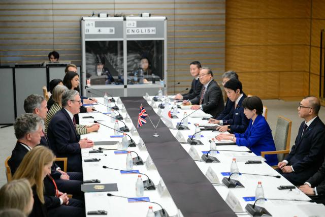 Japan's Prime Minister Sanae Takaichi (2nd R) and Britain's Prime Minister Keir Starmer (5th L) take part in a bilateral meeting at the Prime Minister's Office in Tokyo on January 31, 2026. (Photo by Yuichi YAMAZAKI / POOL / AFP)