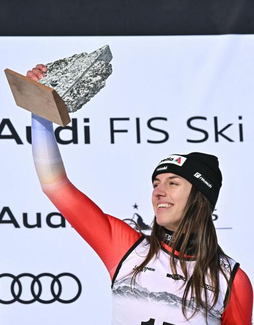 First-placed Switzerland's Malorie Blanc celebrates on the podium after competing in the women's super G race part of the FIS Alpine Ski World Cup 2025-2026, in Crans Montana, Switzerland, on January 31, 2026. (Photo by Fabrice COFFRINI / AFP)