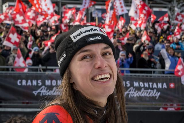 First-placed Switzerland's Malorie Blanc celebrates at the end of the podium ceremony after competing in the women's super G race part of the FIS Alpine Ski World Cup 2025-2026, in Crans Montana, Switzerland, on January 31, 2026. (Photo by Fabrice COFFRINI / AFP)
