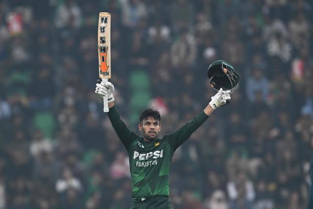 Pakistan's Usman Khan celebrates after scoring a half-century (50 runs) during the second Twenty20 international cricket match between Pakistan and Australia at the Gaddafi Stadium in Lahore on January 31, 2026. (Photo by Arif ALI / AFP)