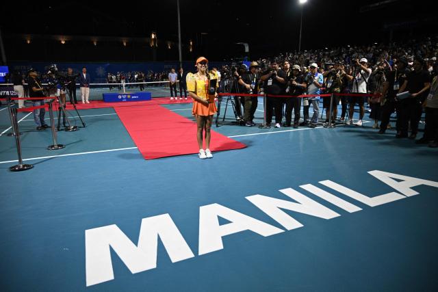 Camila Osorio of Colombia holds the trophy at the award ceremony after winning against Donna Vekic of Croatia during the women's singles finals at the Philippine Women's Open tennis tournament in Manila on January 31, 2026. (Photo by Ted ALJIBE / AFP)