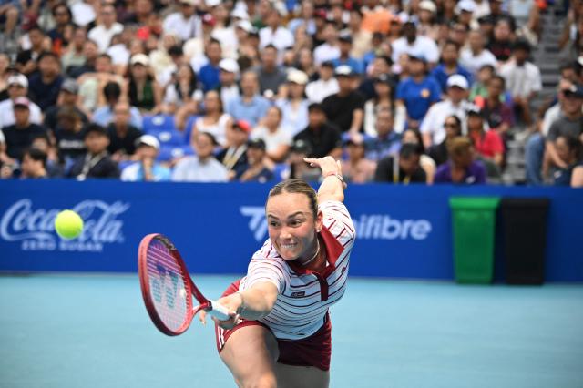 Donna Vekic of Croatia hits a return against Camila Osorio of Colombia during the women's singles finals at the Philippine Women's Open tennis tournament in Manila on January 31, 2026. (Photo by Ted ALJIBE / AFP)