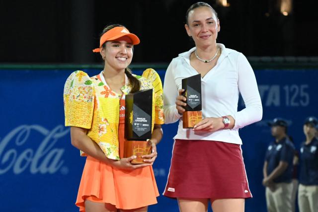 Donna Vekic of Croatia (R) and Camila Osorio of Colombia (L) hold their trophies during the award ceremony in the end of the women's singles finals at the Philippine Women's Open tennis tournament in Manila on January 31, 2026. (Photo by Ted ALJIBE / AFP)