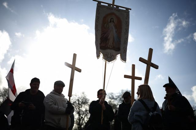 Protesters gather ahead of a "Walk With Jesus" march with members of the UK Independence Party (UKIP), in central London on January 31, 2026. (Photo by HENRY NICHOLLS / AFP)