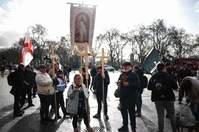 Protesters gather ahead of a "Walk With Jesus" march with members of the UK Independence Party (UKIP), in central London on January 31, 2026. (Photo by HENRY NICHOLLS / AFP)