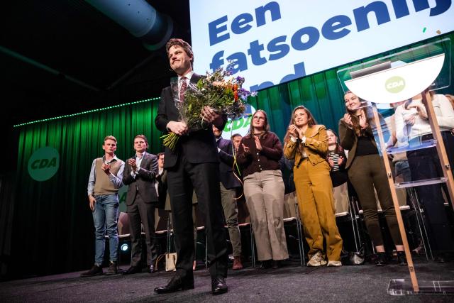 CDA list leader Henri Bontenbal is applauded by the audience after delivering a speech during the party conference ahead of the municipal elections in 'S-Hertogenbosch, on January 31, 2026. (Photo by ROB ENGELAAR / ANP / AFP) / Netherlands OUT