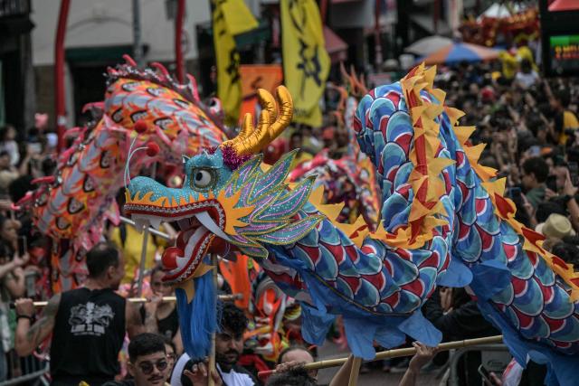 The dragon dance is performed during celebrations marking the Chinese Lunar New Year, which welcomes the Year of the Horse, in the Liberdade district of Sao Paulo, Brazil, on January 31, 2026. (Photo by Nelson ALMEIDA / AFP)