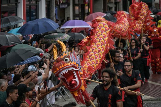 The dragon dance is performed during celebrations marking the Chinese Lunar New Year, which welcomes the Year of the Horse, in the Liberdade district of Sao Paulo, Brazil, on January 31, 2026. (Photo by Nelson ALMEIDA / AFP)