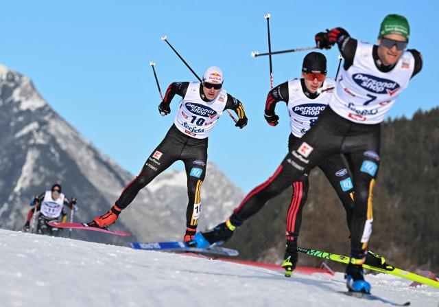 (LtoR) Germany's Vinzenz Geiger, Germany's Richard Stenzel and Germany's Wendelin Thannheimer compete in the Men's Individual Compact 7,5km event at the FIS Ski Nordic Combined World Cup, in Seefeld, Austria on January 31, 2026. (Photo by BARBARA GINDL / APA / AFP) / Austria OUT