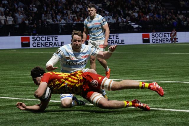 Perpignan's French flanker Max Hicks scores a try during the French Top14 rugby union match between Racing 92 and USA Perpignan at the Paris La Defense Arena in Nanterre, on the outskirts of Paris on January 31, 2026. (Photo by GEOFFROY VAN DER HASSELT / AFP)