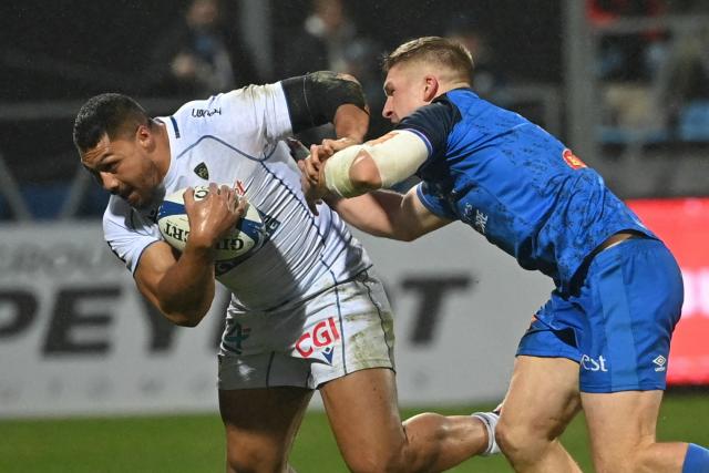 Clermont's New Zealand centre George Moala (L) is tackled during the French Top 14 rugby union match between Castres Olympique and ASM Clermont Auvergne at Stade Pierre Fabre in Castres, southern France on January 31, 2026. (Photo by Matthieu RONDEL / AFP)