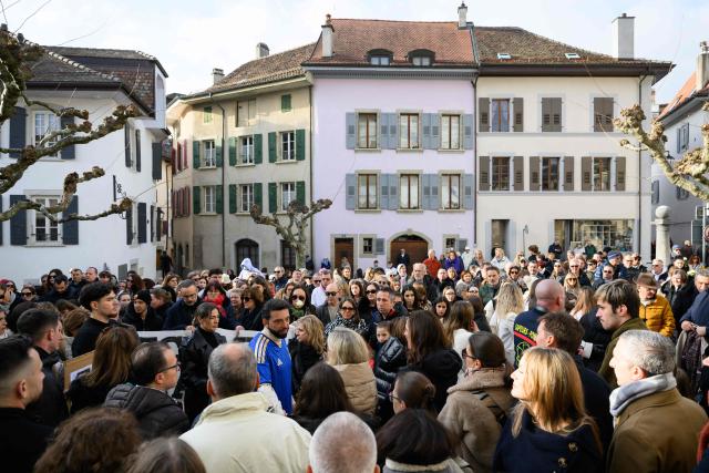 Attendees take part in a silent march organized in memory of some of the victims of the Crans Montana deadly New Year's Eve fire, in Lutry, near Lausanne, on January 31, 2026. The fire on January 1 at the bar "Le Constellation" left 40 people dead -- including nine French and six Italian nationals -- and injured 116 others, most of them teenagers. (Photo by Harold CUNNINGHAM / AFP)