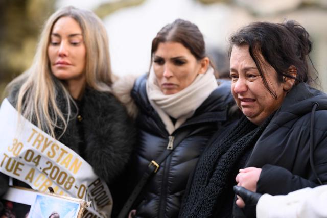 A mother (R) of victim who died in the fire cries as she takes part to a silent march organized in memory of some of the victims of the Crans Montana deadly New Year's Eve fire, in Lutry, near Lausanne, on January 31, 2026. The fire on January 1 at the bar "Le Constellation" left 40 people dead -- including nine French and six Italian nationals -- and injured 116 others, most of them teenagers. (Photo by Harold CUNNINGHAM / AFP)