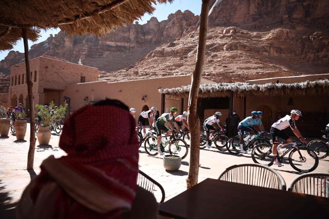 The pack cycles in the fifth and last stage of the AlUla Tour cycling race, 163.9km from Alula Old Town to Skyviews of Harrat Uwayrid on January 31, 2026. (Photo by Anne-Christine POUJOULAT / AFP)