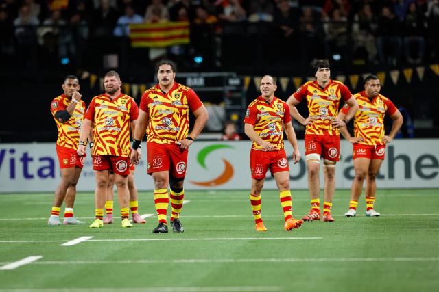 Perpignan's players react at the end of the French Top14 rugby union match between Racing 92 and USA Perpignan at the Paris La Defense Arena in Nanterre, on the outskirts of Paris on January 31, 2026. (Photo by GEOFFROY VAN DER HASSELT / AFP)