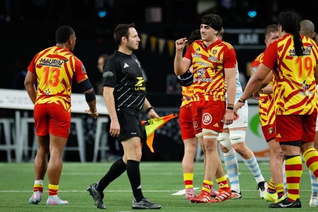 Perpignan's players react at the end of the French Top14 rugby union match between Racing 92 and USA Perpignan at the Paris La Defense Arena in Nanterre, on the outskirts of Paris on January 31, 2026. (Photo by GEOFFROY VAN DER HASSELT / AFP)