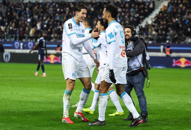 Marseille's Gabonese forward #97 Pierre-Emerick Aubameyang (R) celebrates scoring his team's second goal with Marseille's Maroccan defender #21 Nayef Aguerd during the French L1 football match between Paris FC and Olympique de Marseille at the Stade Jean-Bouin in Paris on January 31, 2026. (Photo by Alain JOCARD / AFP)