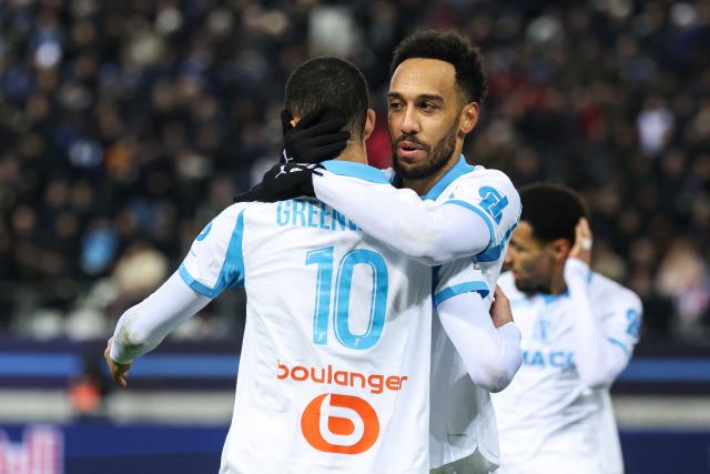 Marseille's Gabonese forward #97 Pierre-Emerick Aubameyang (R) celebrates scoring his team's second goal with Marseille's English forward #10 Mason Greenwood during the French L1 football match between Paris FC and Olympique de Marseille at the Stade Jean-Bouin in Paris on January 31, 2026. (Photo by Alain JOCARD / AFP)