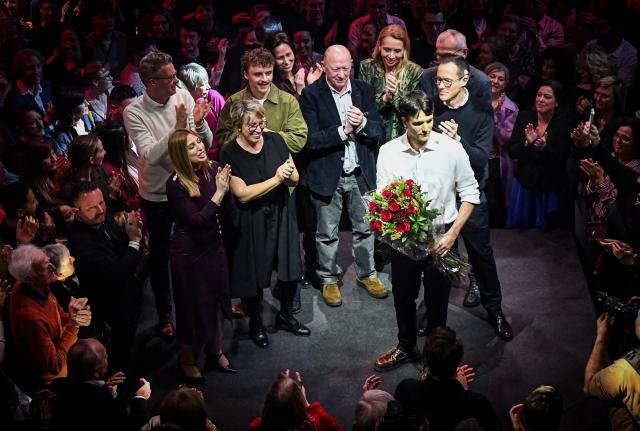 Vooruit's chairman Conner Rousseau (bottom R) takes part in the new year's reception of Flemish socialist party Vooruit, in Hasselt on January 31, 2026. (Photo by NICOLAS MAETERLINCK / Belga / AFP) / Belgium OUT