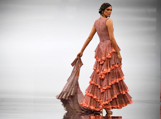 A model presents a creation by Cristina Vazquez during the International Flamenco Fashion Week - SIMOF in Seville on January 31, 2026. (Photo by CRISTINA QUICLER / AFP)