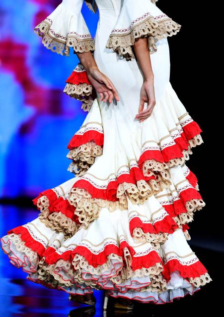 A model presents a creation by Cristina Vazquez during the International Flamenco Fashion Week - SIMOF in Seville on January 31, 2026. (Photo by CRISTINA QUICLER / AFP)